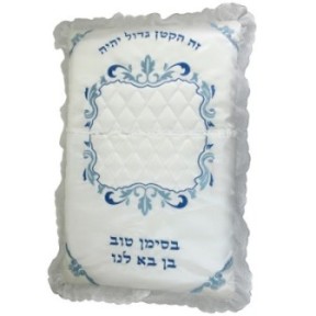 An elegant satin cushion with a lace around, thick embroidery ...